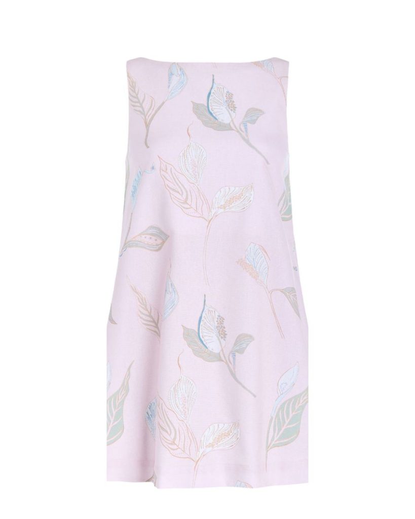 Light pink scarf with a pastel botanical leaf pattern scattered across the fabric